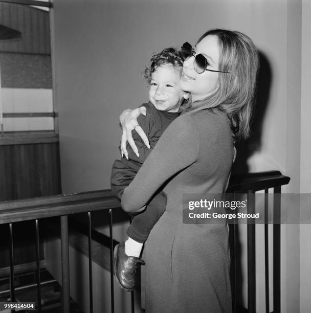 American singer, songwriter, actress, and filmmaker Barbra Streisand with her son Jason Gould at Heathrow Airport, London, UK, 11th April 1969.