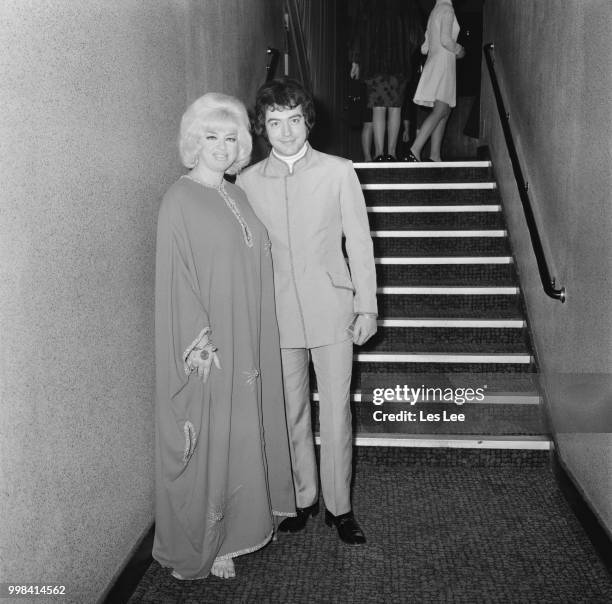 English film actress and singer Diana Dors with her husband Alan Lake at the premiere of crime comedy film 'Crooks and Coronets' at the Warner West...