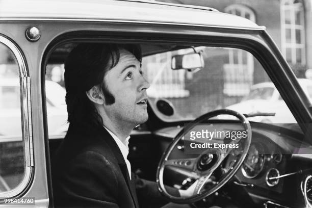 English singer-songwriter, multi-instrumentalist, and composer Paul McCartney leaving Apple Headquarters in his Mini car, London, UK, 19th April 1969.