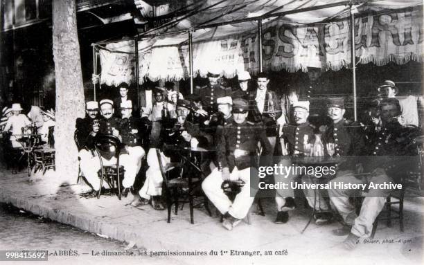 French legionnaire colonial soldiers relaxing off duty, Sidi Bel Abbes, Algeria. Postcard 1909.