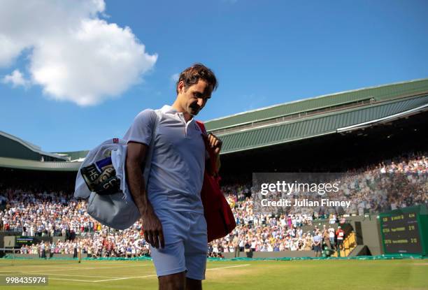 Roger Federer of Switzerland thanks the crowd after losing his Men's Singles Quarter-Finals match against Kevin Anderson of South Africa on day nine...