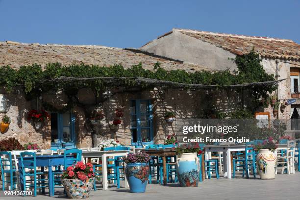 Restaurants in the central square of Marzamemi on June 05, 2018 in Marzamemi Syracuse, Italy. Marzamemi is a southern Italian hamlet of Pachino, a...