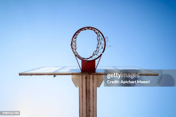 basketball hoop in the blue sky - space travel stock-fotos und bilder