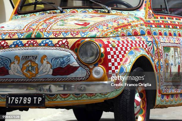 An old and painted FIAT 500 is seen at Selinunte beach on June 07, 2018 in Selinunte Trapani, Italy. Selinunte was an ancient Greek city on the...