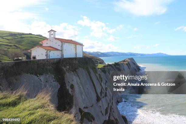 chapel of san telmo and itzurun beach in zumaia, basque country - amaia - fotografias e filmes do acervo