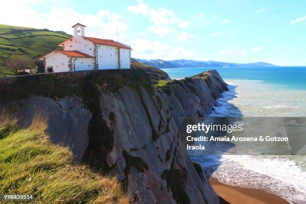 chapel of san telmo and itzurun beach in zumaia, basque country - amaia - fotografias e filmes do acervo