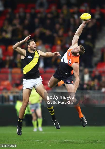 Dawson Simpson of the Giants is challenged by Toby Nankervis of the Tigers during the round 17 AFL match between the Greater Western Sydney Giants...