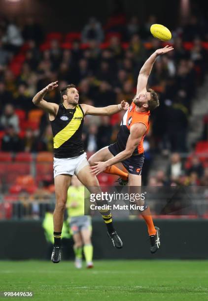 Dawson Simpson of the Giants is challenged by Toby Nankervis of the Tigers during the round 17 AFL match between the Greater Western Sydney Giants...