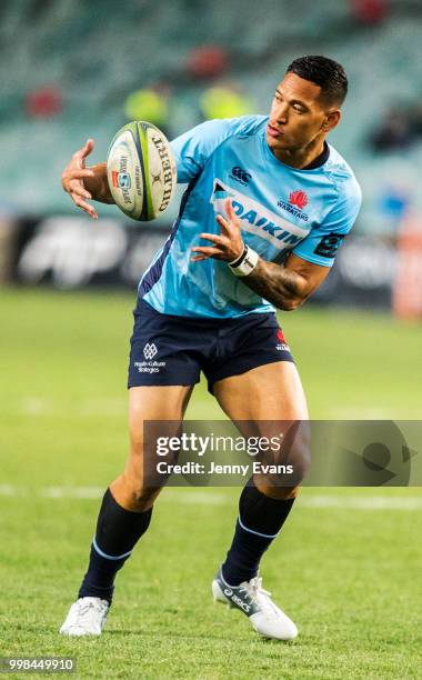 Israel Folau of the Waratahs passes the ball during a warm up before the round 19 Super Rugby match between the Waratahs and the Brumbies at Allianz...