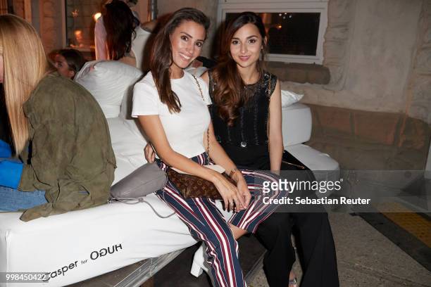 Nadine Menz and Rona Oezkan attend the HUGO show during the Berlin Fashion Week Spring/Summer 2019 at Motorwerk on July 5, 2018 in Berlin, Germany.