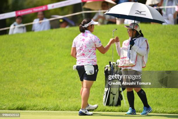 Fumika Kawagishi of Japan celebrates after making her birdie putt on the 18th hole during the second round of the Samantha Thavasa Girls Collection...