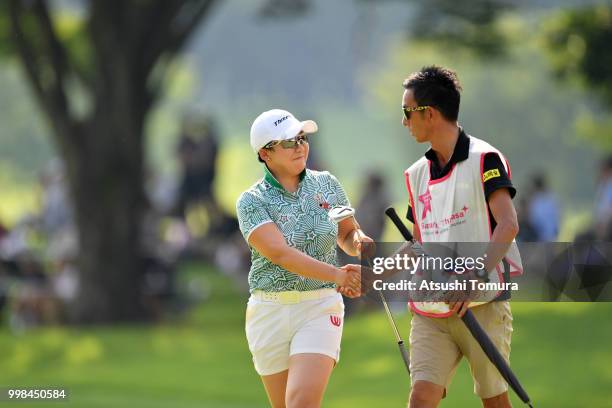 Jiyai Shin of South Korea shake hand with her caddie during the second round of the Samantha Thavasa Girls Collection Ladies Tournament at the Eagle...