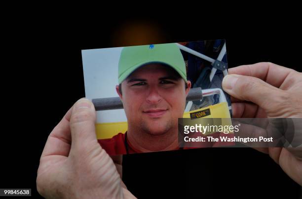 Father Keith Jones holds a family photo of Gordon Jones who was killed in the Deepwater Horizon oil rig disaste at his home in Baton Rouge, LA on May...