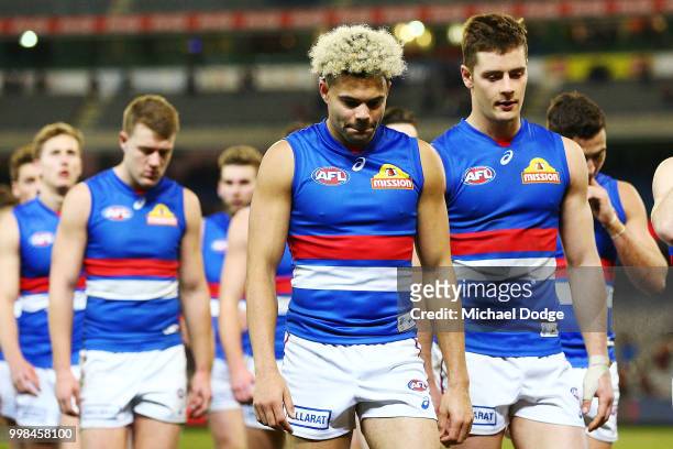 Jason Johannisen of the Bulldogs looks dejected after losing his 100th match during the round 17 AFL match between the Melbourne Demons and the...