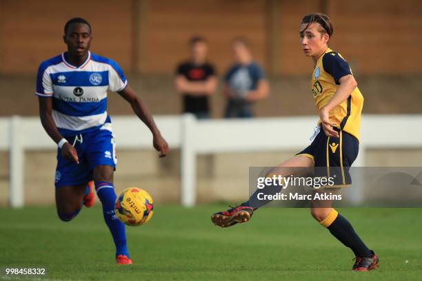 Harry Wickens of Staines Town in action with Bright Osayi-Samuel of QPR during the Pre-Season Friendly between Staines Town and Queens Park Rangers...