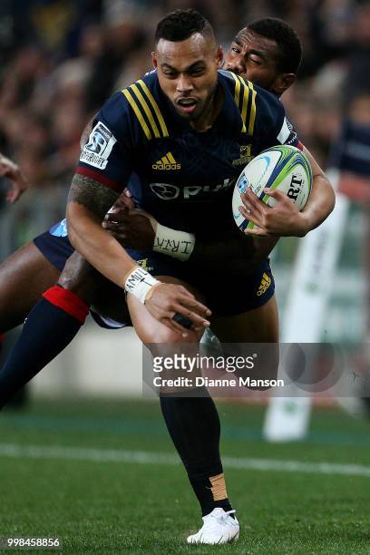 Tevita Li of the Highlanders is tackled by Marika Koroibete of the Rebels during the round 19 Super Rugby match between the Highlanders and the...