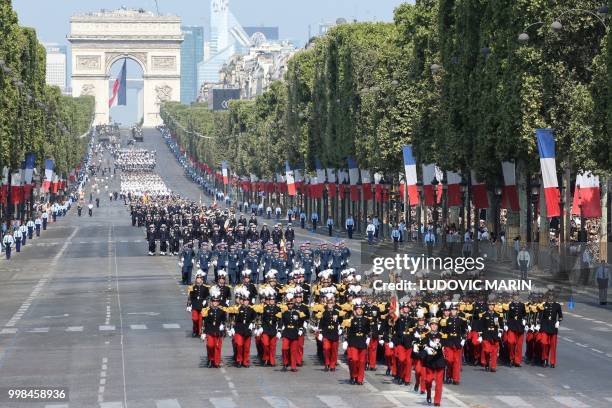 General view shows Members of the Ecole speciale militaire de Saint-Cyr and other military regiments taking part in the annual Bastille Day military...