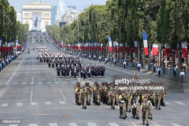 Members of the Regiment du Service Militaire Adapte de Mayotte march during the annual Bastille Day military parade on the Champs-Elysees avenue in...