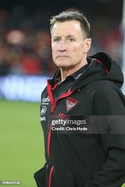 Bombers coach John Worsfold looks on during the round 17 AFL match between the Gold Coast Suns and the Essendon Bombers at Metricon Stadium on July...