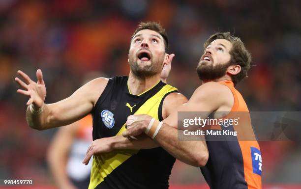 Toby Nankervis of the Tigers is challenged by Callan Ward of the Giants during the round 17 AFL match between the Greater Western Sydney Giants and...