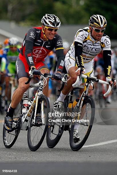 Lance Armstrong of team Radio Shack rides with Bernhard Eisel of Austria riding for team HTC-Columbia during stage two of the Tour of California on...