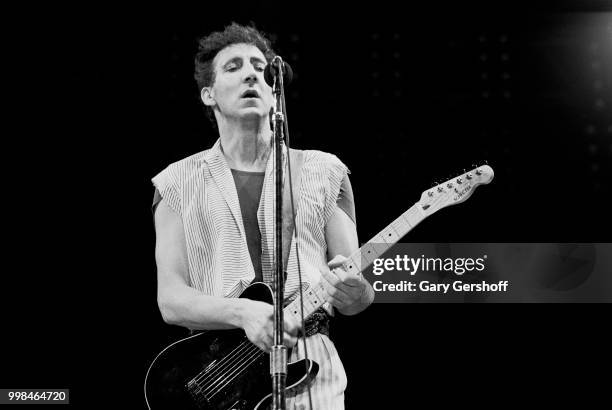 British musician Pete Townshend, of the Rock group the Who, plays guitar as he performs onstage at Shea Stadium, New York, New York, October 13, 1982.