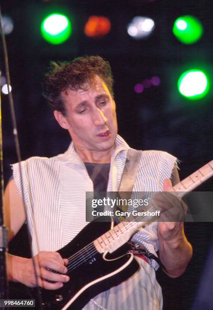 British musician Pete Townshend, of the Rock group the Who, plays guitar as he performs onstage at Shea Stadium, New York, New York, October 13, 1982.