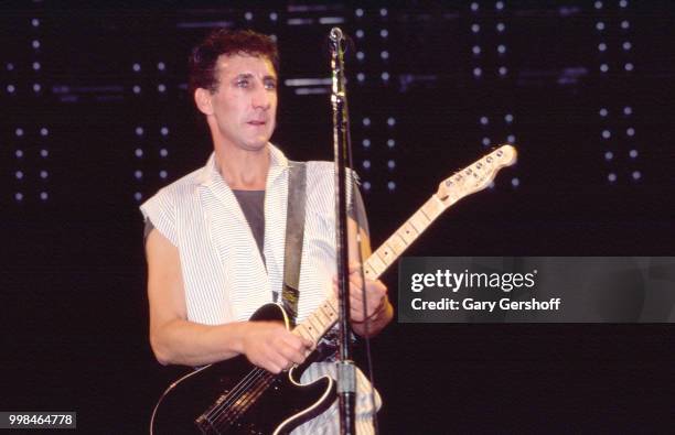 British musician Pete Townshend, of the Rock group the Who, plays guitar as he performs onstage at Shea Stadium, New York, New York, October 13, 1982.