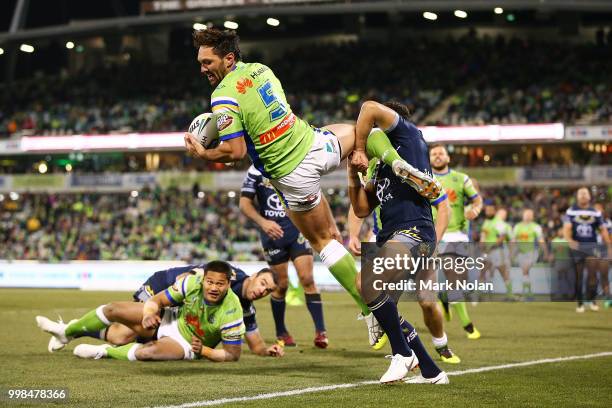 Jordan Rapana of the Raiders takes a high ball and scores a try during the round 18 NRL match between the Canberra Raiders and the North Queensland...