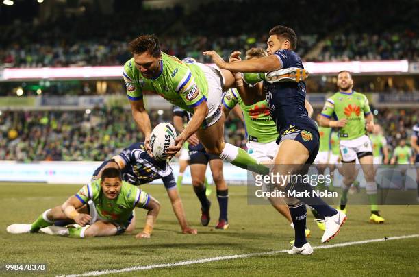 Jordan Rapana of the Raiders takes a high ball and scores a try during the round 18 NRL match between the Canberra Raiders and the North Queensland...