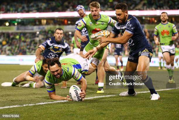 Jordan Rapana of the Raiders takes a high ball and scores a try during the round 18 NRL match between the Canberra Raiders and the North Queensland...