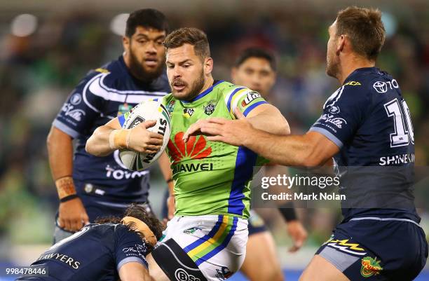 Aiden Sezer of the Raiders is tackled during the round 18 NRL match between the Canberra Raiders and the North Queensland Cowboys at GIO Stadium on...