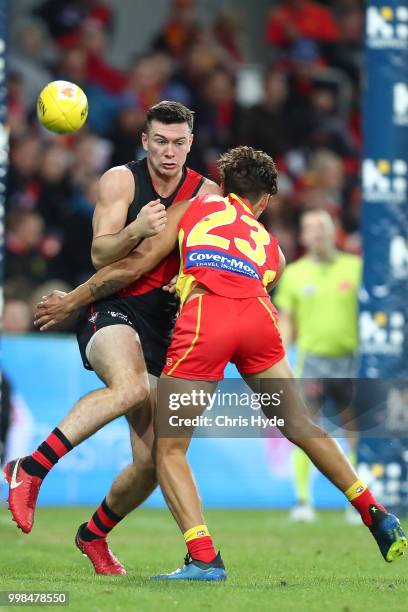 Conor McKenna of the Bombers kicks during the round 17 AFL match between the Gold Coast Suns and the Essendon Bombers at Metricon Stadium on July 14,...