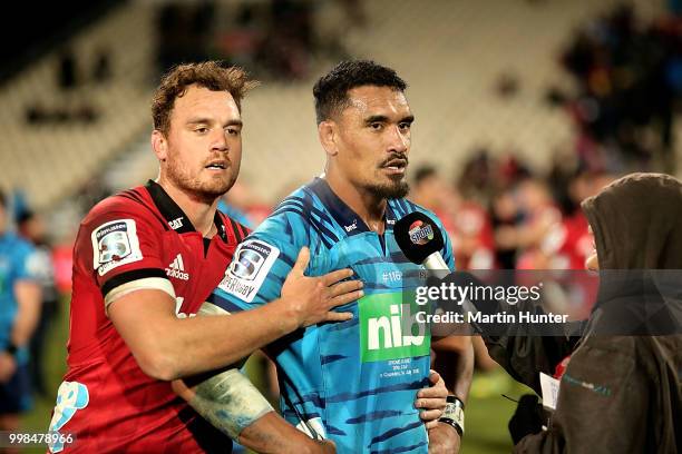 Israel Dagg of the Crusaders and Jerome Kaino of the Blues after the round 19 Super Rugby match between the Crusaders and the Blues at AMI Stadium on...