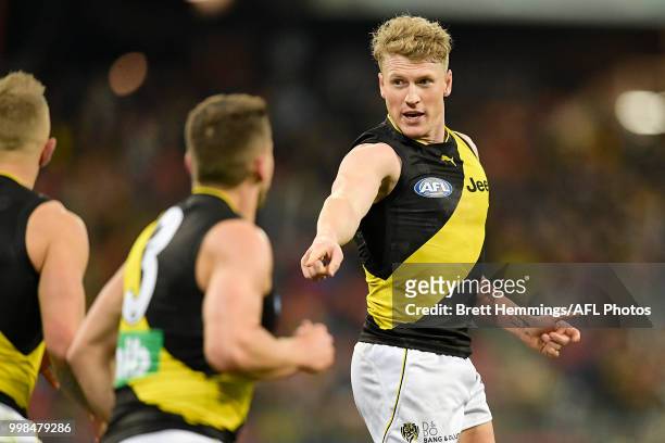 Josh Caddy of the Tigers celebrates kicking a goal during the round 17 AFL match between the Greater Western Sydney Giants and the Richmond Tigers at...