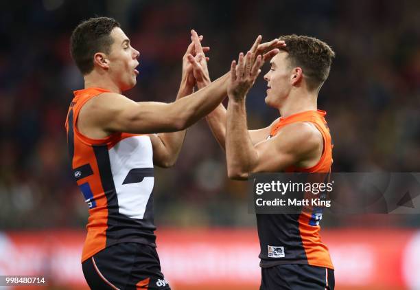 Zac Langdon of the Giants celebrates with Josh Kelly after kicking a goal during the round 17 AFL match between the Greater Western Sydney Giants and...