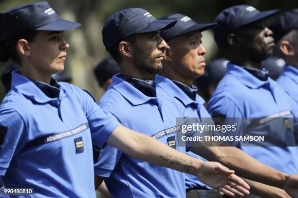 Members of the French prison administration march during the annual Bastille Day military parade on the Champs-Elysees avenue in Paris on July 14,...