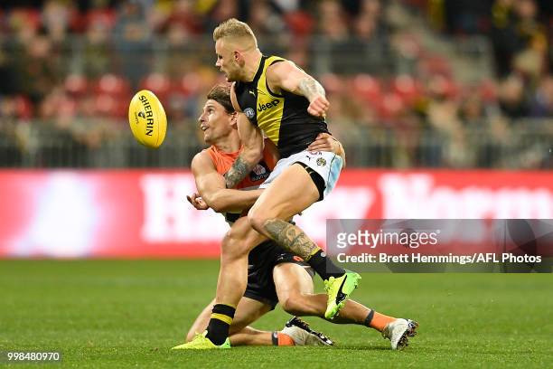Brandon Ellis of the Tigers is tackled by Ryan Griffen of the Giants during the round 17 AFL match between the Greater Western Sydney Giants and the...