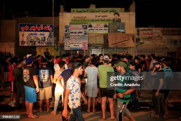 Iraqi citizens gather to protest government due to lack of basic services and frequent power outages in capital city Baghdat, like the ones currently...