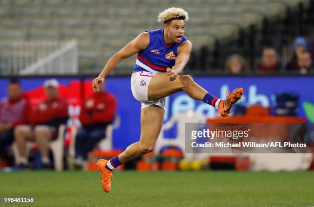 Jason Johannisen of the Bulldogs kicks a goal during the 2018 AFL round 17 match between the Melbourne Demons and the Western Bulldogs at the...