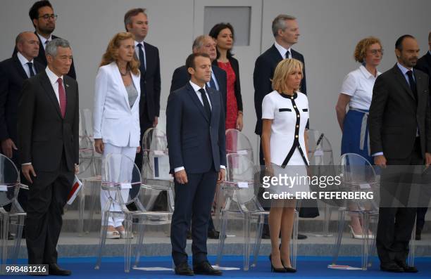 French President Emmanuel Macron stands with Singapore's Prime Minister Lee Hsien Loong his wife Brigitte Macron , French Labour Minister Muriel...