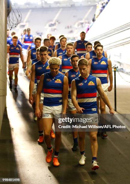 Jason Johannisen of the Bulldogs and Lachie Hunter of the Bulldogs chat after the 2018 AFL round 17 match between the Melbourne Demons and the...