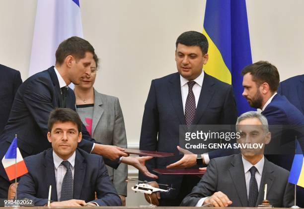 French Ambassador to Ukraine Isabelle Dumont and Prime Minister of Ukraine Volodymyr Groysman look while CEO of Airbus Helicopters Bruno Even and...