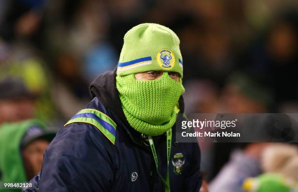 Raiders fan watches on during the round 18 NRL match between the Canberra Raiders and the North Queensland Cowboys at GIO Stadium on July 14, 2018 in...