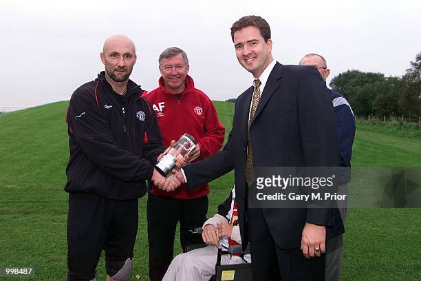 Sir Alex Ferguson and Fabien Barthez of Manchester United receive their footballranking.com awards for best manager and goalkeeper at the Manchester...