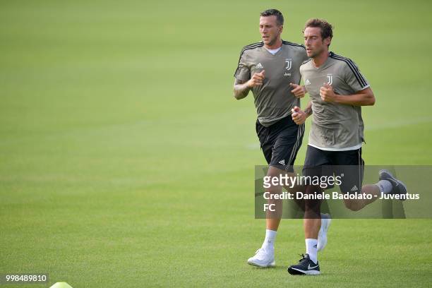 Federico Bernardeschi and Claudio Marchisio during a Juventus morning training session on July 14, 2018 in Turin, Italy.