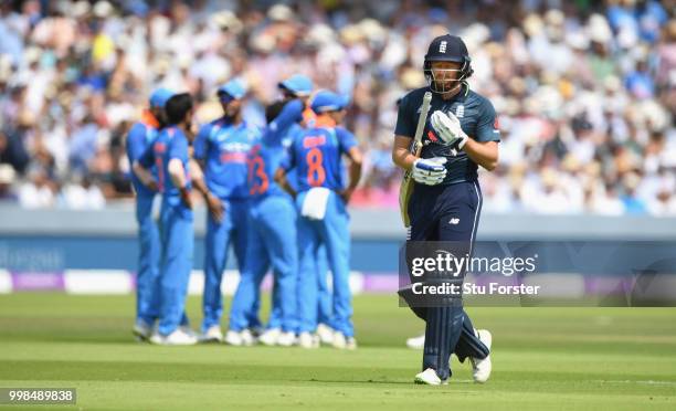 England batsman Jonathan Bairstow leaves the field after being bowled by India bowler Kuldeep Yadav as he celebrates with Virat Kohli during the 2nd...