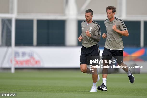 Federico Bernardeschi and Claudio Marchisio during a Juventus morning training session on July 14, 2018 in Turin, Italy.