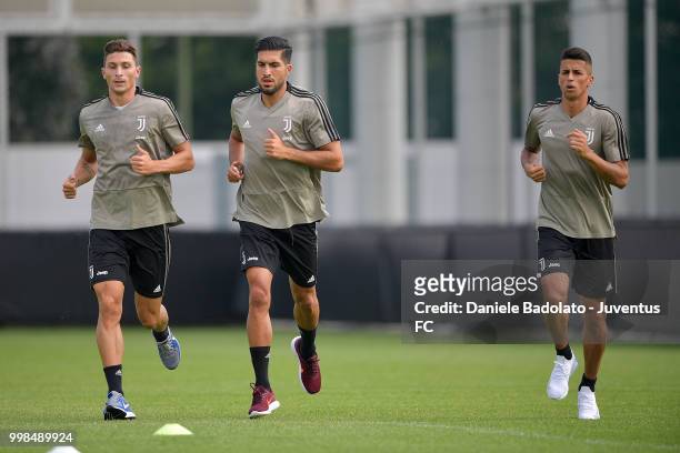 Mattia Caldara , Emre Can and Joao Cancelo during a Juventus morning training session on July 14, 2018 in Turin, Italy.