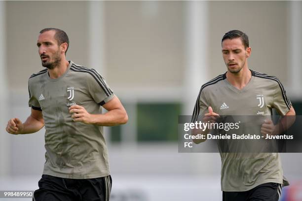 Giorgio Chiellini and Mattia De Sciglio during a Juventus morning training session on July 14, 2018 in Turin, Italy.